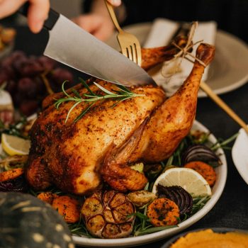 A delicious roasted chicken with vegetables, perfect for a holiday feast.